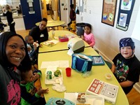 students with Ms. Hodge at lunch