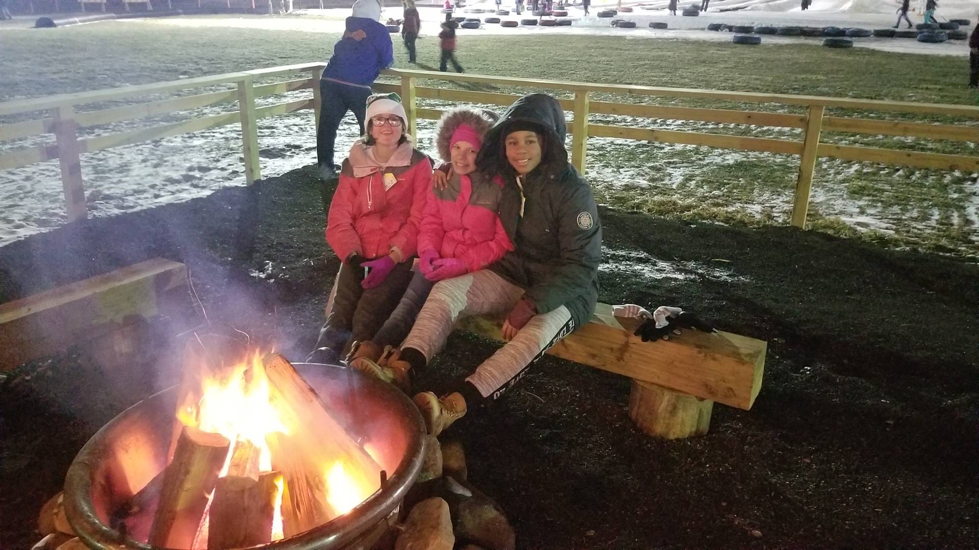 students around a campfire