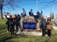 program participants at the Maple Leaf sign