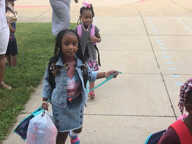kindergarten girls line up to start school