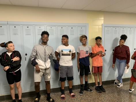 Students standing in the hallway.